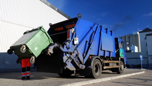 Construction site with builders removing waste